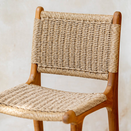 Natural woven Bar Stool from The Bali Concept with a comfortable rattan seat and sturdy wooden frame