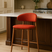 Nisu Home Bar Stool in vibrant orange fabric with wooden legs for modern kitchen decor