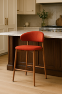 Nisu Home Bar Stool in vibrant orange fabric with wooden legs for modern kitchen decor