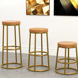 Set of three Nisu Home bar stools with gold frames and tan upholstered seats for stylish seating
