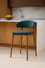 Nisu Home Bar Stool with teal upholstery and wooden legs, perfect for modern kitchen settings