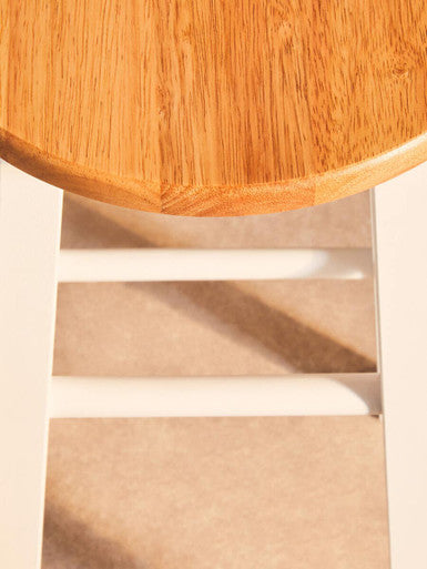 Orsina Bar Stool with a natural wood top and white metal legs for modern bar seating