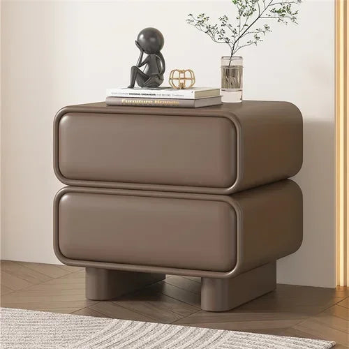 Klassyx modern bedside table in brown with rounded edges and decorative items on top