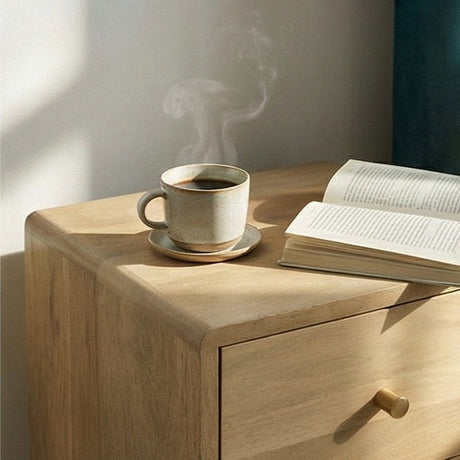 Fishe and Lilly Bedside Table in Natural Wood with a Cup and Open Book on Top