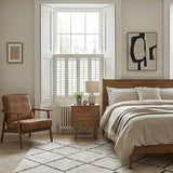 Fishe and Lilly bedside table in a minimalist bedroom with natural light and neutral colours