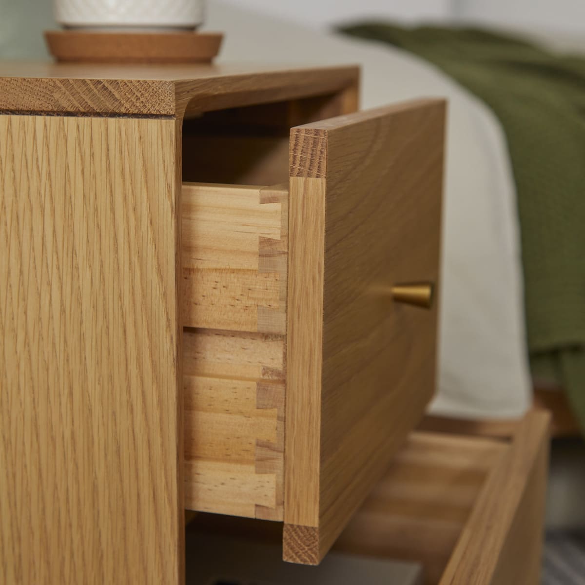 Fishe and Lilly Bedside Table with open drawer showcasing natural wood grain and elegant design