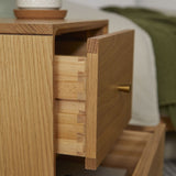 Fishe and Lilly Bedside Table with open drawer showcasing natural wood grain and elegant design