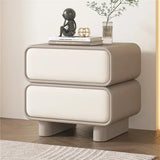 Klassyx modern bedside table with two drawers, topped with a decorative figure and flowers