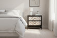 Orsina Bedside Table with two drawers and modern design in a softly lit bedroom