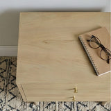 Fishe and Lilly natural wood bedside table with two drawers and a notebook on top