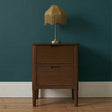 Fishe and Lilly Bedside Table in wood with two drawers and a vintage lamp on top