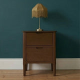 Fishe and Lilly Bedside Table in wood with two drawers and a vintage lamp on top