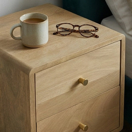 Fishe and Lilly wooden bedside table with two drawers, coffee cup and glasses on top