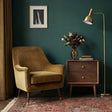 Stylish Fishe and Lilly bedside table in a modern living room setting with a floral vase and lamp