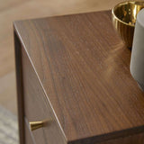 Fishe and Lilly Bedside Table with a sleek wood finish and elegant gold accents