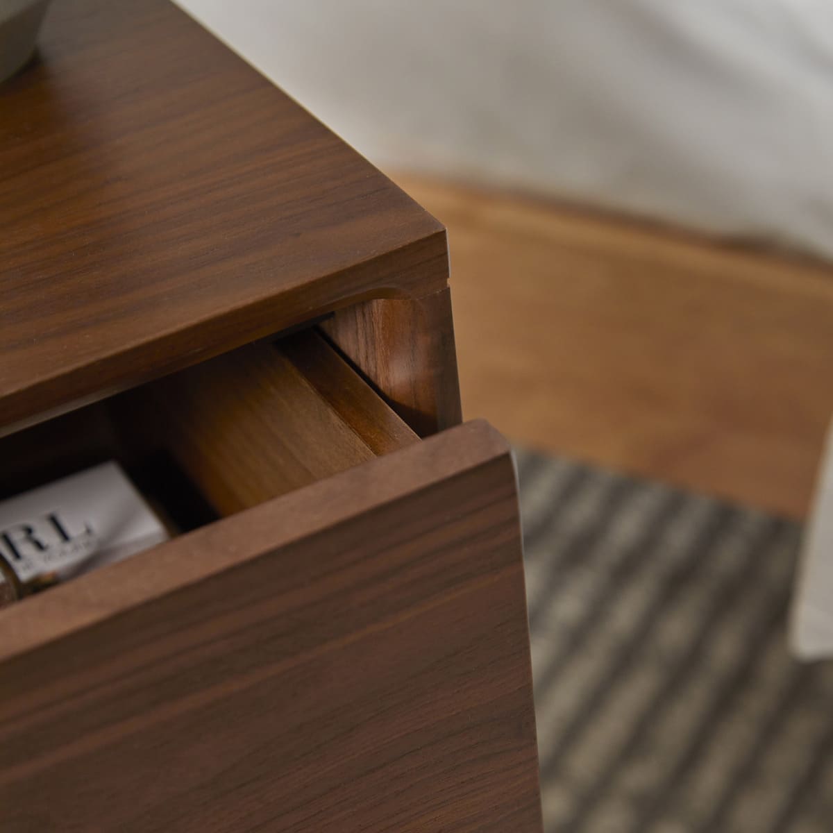 Close-up of Fishe and Lilly Bedside Table featuring a smooth drawer for easy storage