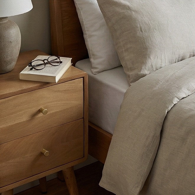 Fishe and Lilly Bedside Table in wood with a lamp and books, perfect for modern bedrooms