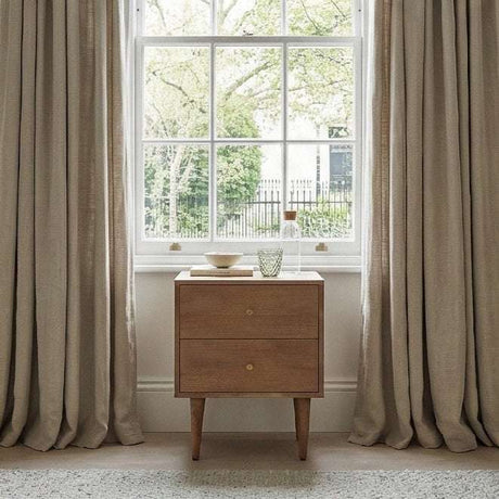 Fishe and Lilly Bedside Table in Natural Wood Beside a Window with Decorative Items
