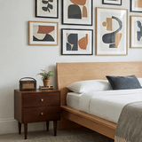 Fishe and Lilly bedside table with two drawers beside a stylish bed and framed wall art