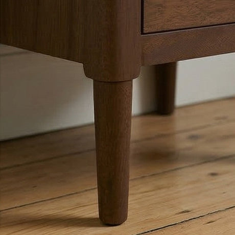 Fishe and Lilly Bedside Table featuring elegant wooden legs and a sleek drawer design