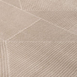 Close-up of a textured beige rug with geometric patterns, ideal for any modern home decor