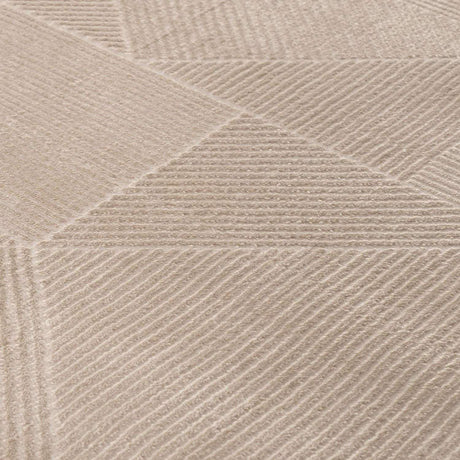 Close-up of a textured beige rug with geometric patterns, ideal for any modern home decor