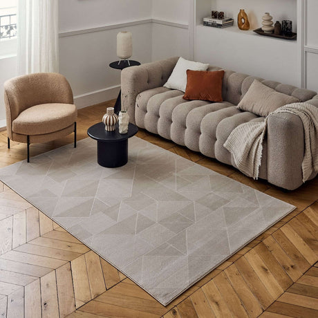 Stylish beige rug with geometric patterns in a modern living room setting