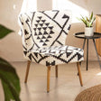 Orsina Berber Style Chair with black and white geometric pattern and wooden legs, perfect for stylish interiors