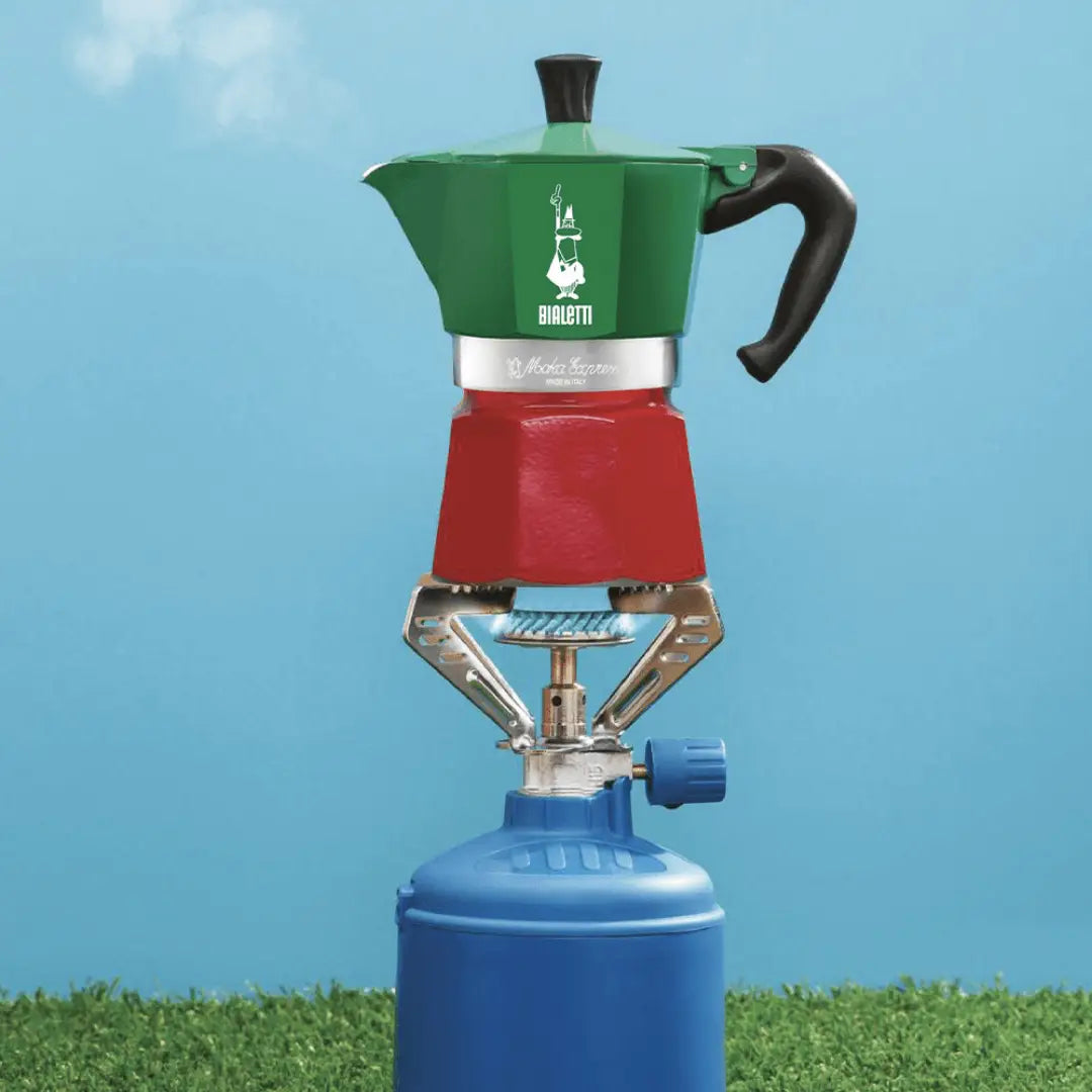 Bialetti Coffee Maker in green and red, ideal for brewing coffee outdoors with a gas canister