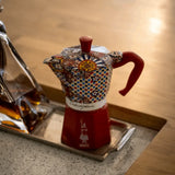 Bialetti Moka Express coffee maker with vibrant decorative patterns, perfect for brewing espresso