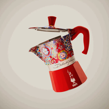 Bialetti Moka Express with vibrant red and colourful design for brewing authentic Italian coffee