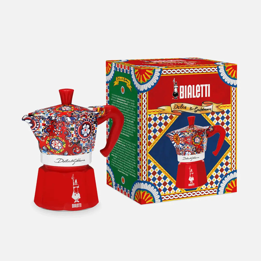 Bialetti Moka Express coffee maker in red with a vibrant floral design and its decorative box