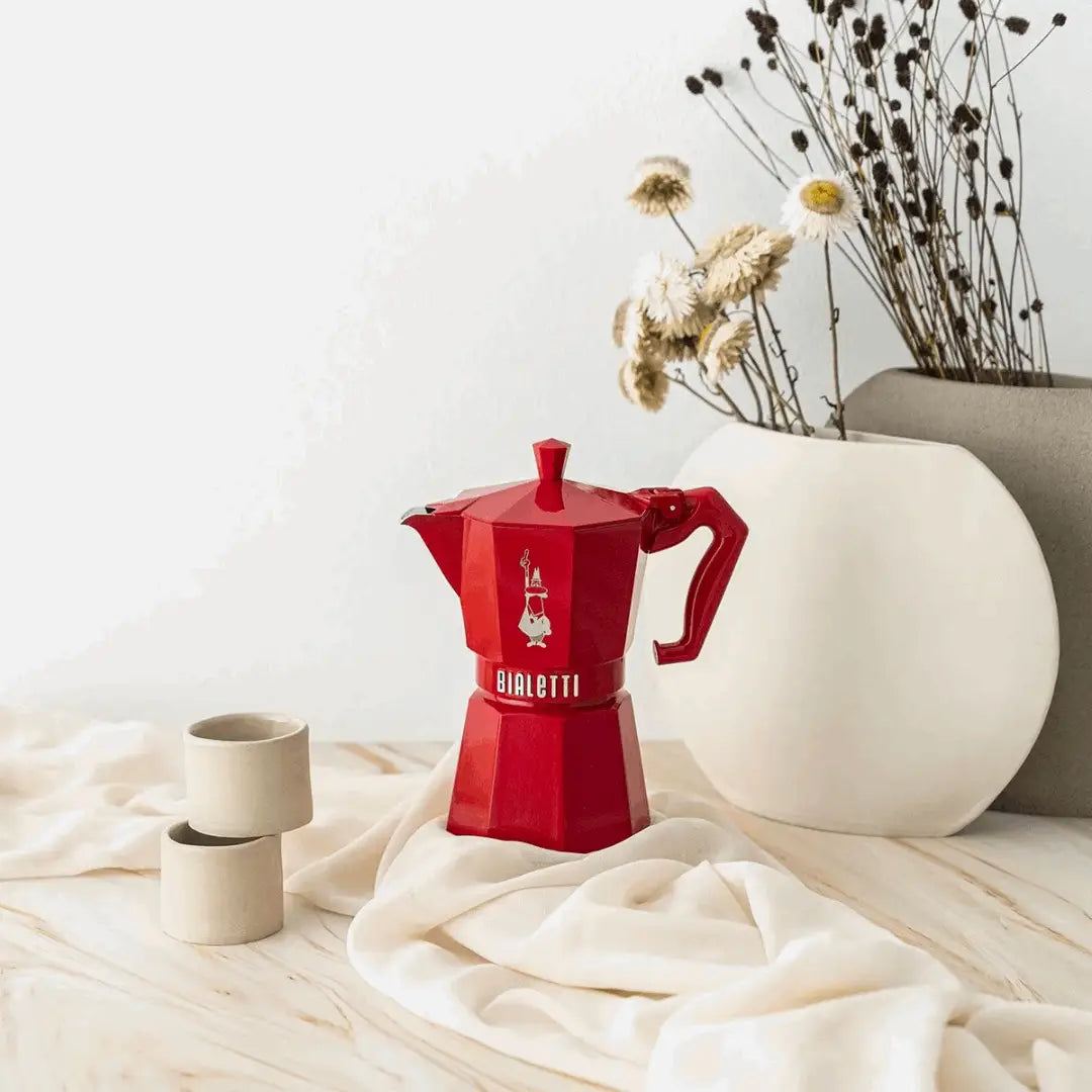 Bialetti Moka Express stovetop coffee maker in red, perfect for brewing rich espresso at home