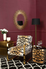 Stylish Black and White Rug under a bold lounge chair in a modern living room setting