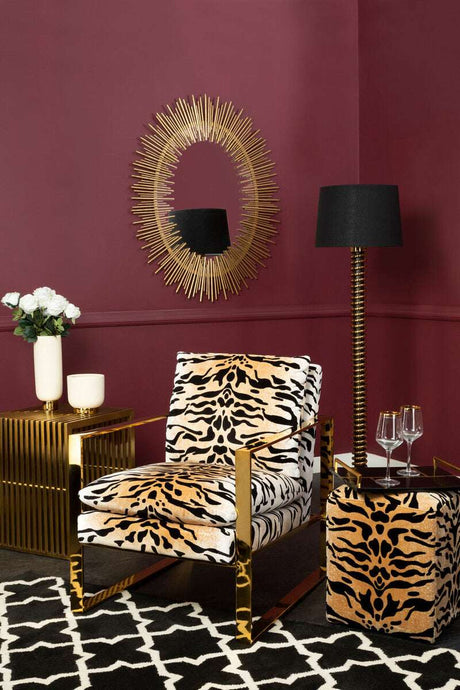 Stylish Black and White Rug under a bold lounge chair in a modern living room setting