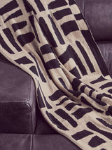 Orsina Black Throw with Modern Abstract Pattern on a Sofa for Cozy Home Decor