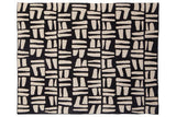 Orsina Black Throw featuring a modern abstract pattern in cream and black