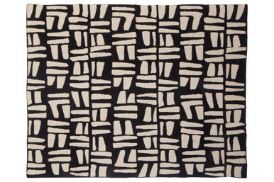 Orsina Black Throw featuring a modern abstract pattern in cream and black