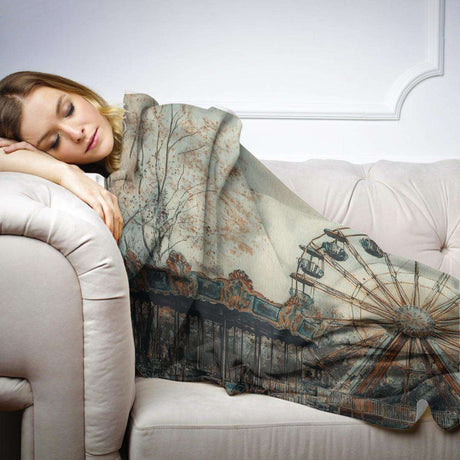 Cozy HOME ART HAVEN blanket featuring a vintage amusement park design, perfect for lounging on the sofa