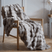 Luxury Faux Fur Throw in Soft Grey Draped on a Wooden Chair for Elegant Home Decor