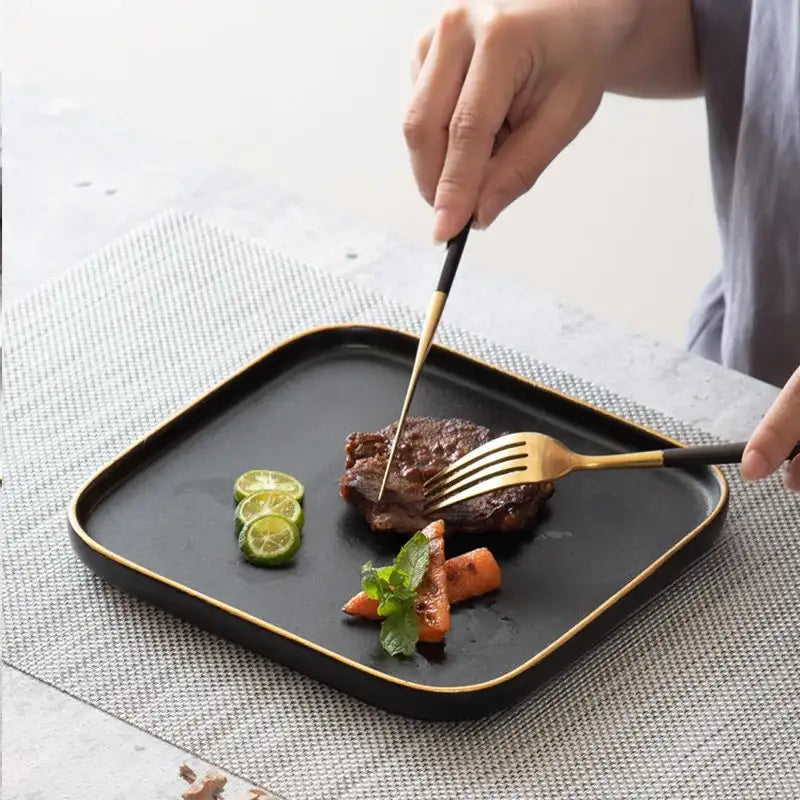 Elegant Nisu Home Blino Plates showcasing a steak dish with garnishes on a dining table