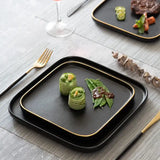 Elegant Nisu Home Blino Plates in Black with Gold Trim for Stylish Dining Experiences