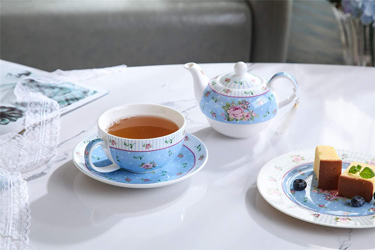 Elegant blue floral tea cup with matching saucer and teapot for a charming tea experience