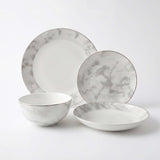 Elegant Bone China Dinner Set with Marble Design, including plates and bowls for stylish dining