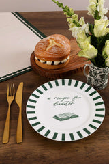 Avalon Home UK Bone China Plate with a green striped border and a recipe design, paired with a pastry and flowers