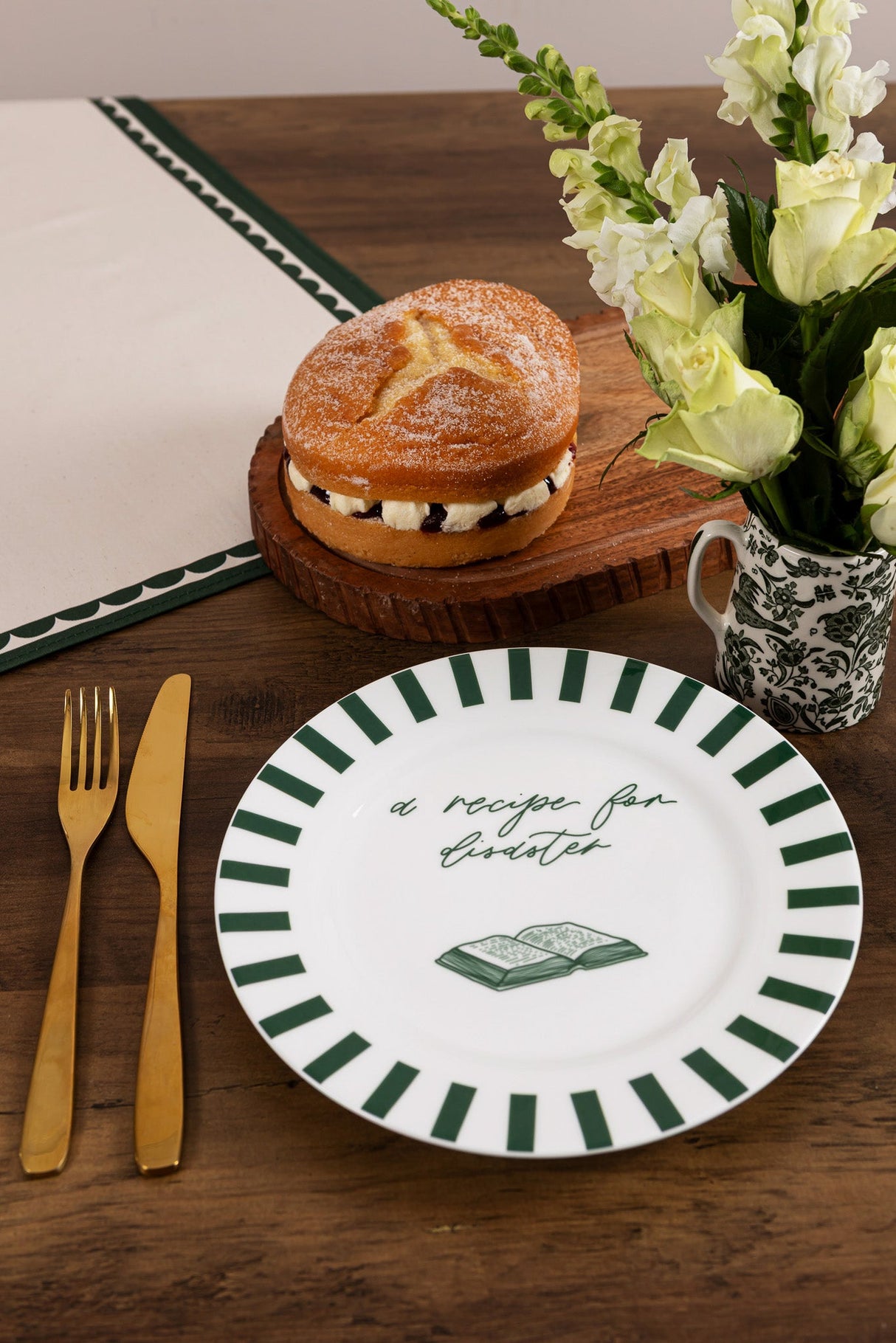 Avalon Home UK Bone China Plate with a green striped border and a recipe design, paired with a pastry and flowers