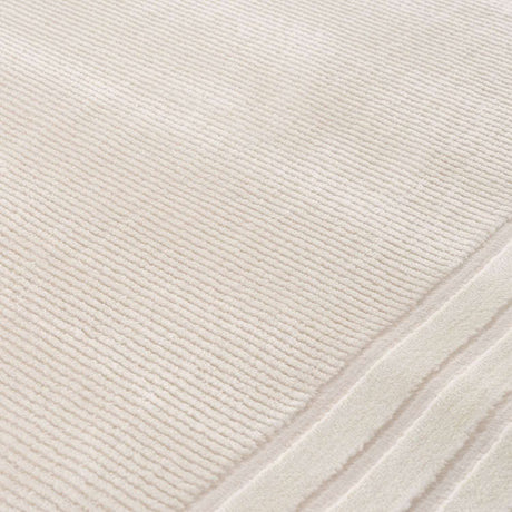 Elegant Bordered Rug in soft cream colour, perfect for adding warmth and style to any room