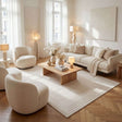 Elegant Bordered Rug in a modern living room with neutral furniture and warm lighting