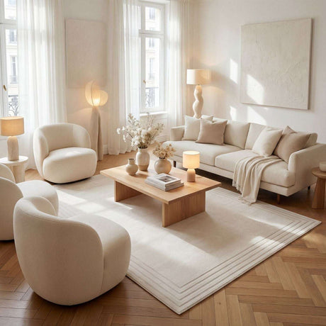 Elegant Bordered Rug in a modern living room with neutral furniture and warm lighting