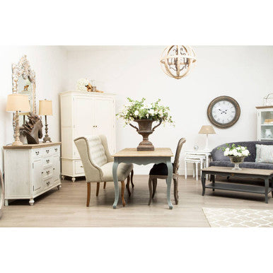 Stylish dining room featuring a Brown and Natural Rug under an elegant table with decorative furnishings